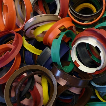 A colorful assortment of plastic rings stacked together.
